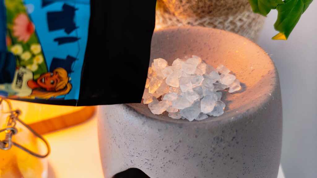 pouring-correct-amount-of-sizzlers-scented-crystals-into-tealight-burner-dish