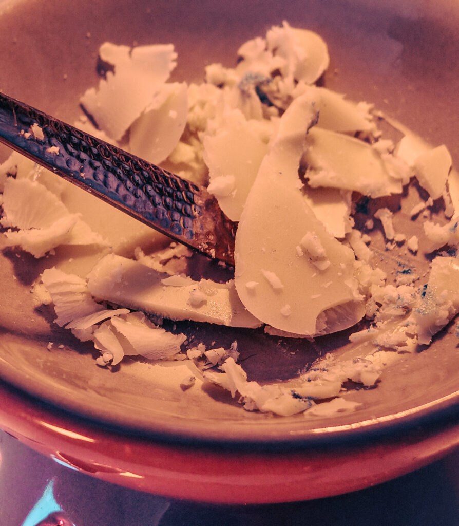 Scraping wax melt from burner