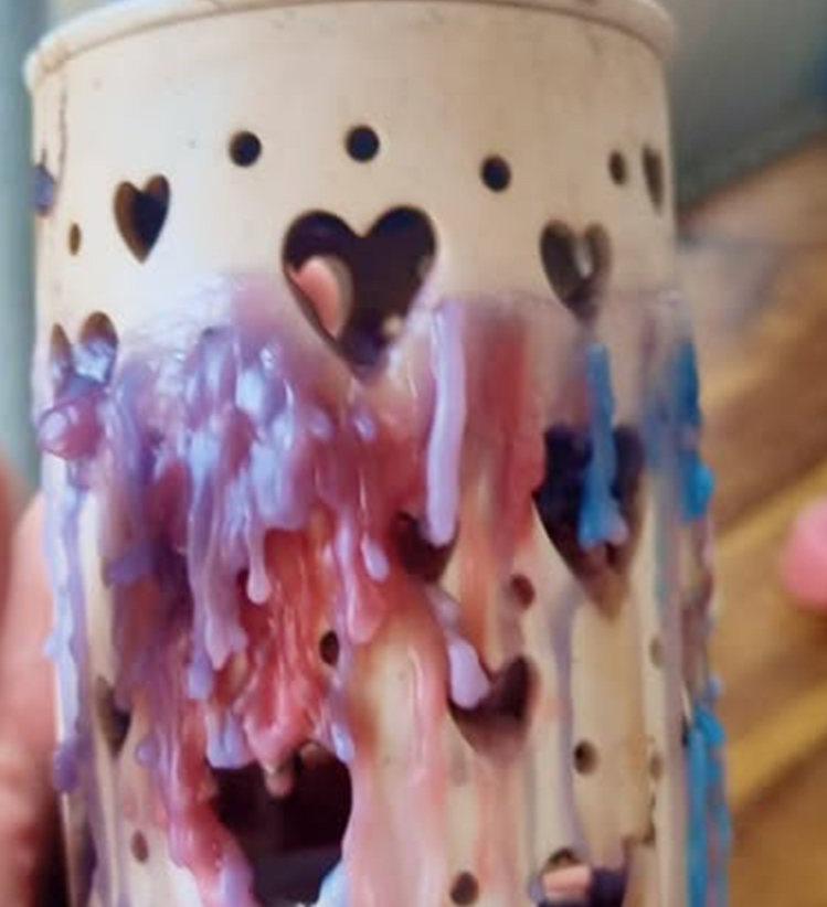 ceramic wax melt burner used to warm scented wax melts that needs cleaned properly to remove wax dripping