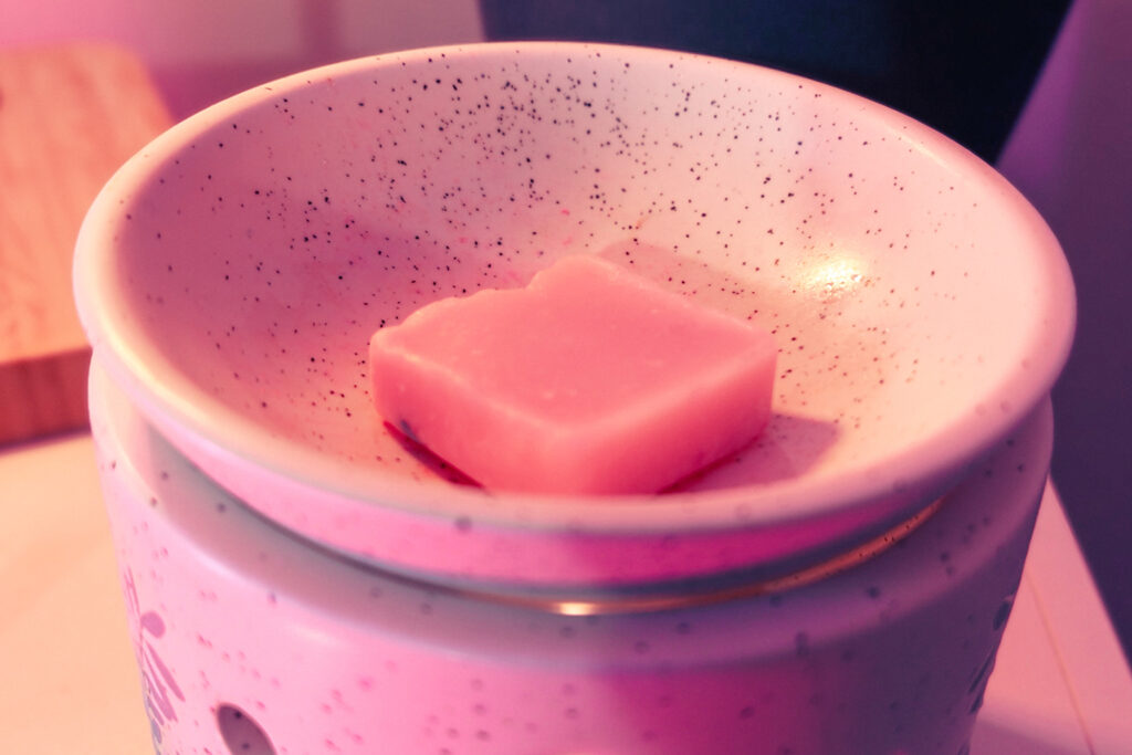 Wax melt cube placed in a burner dish before melting