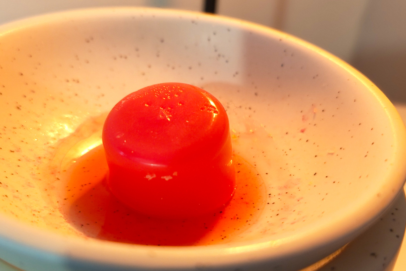 wax melt melting in a burner dish in a cosy home