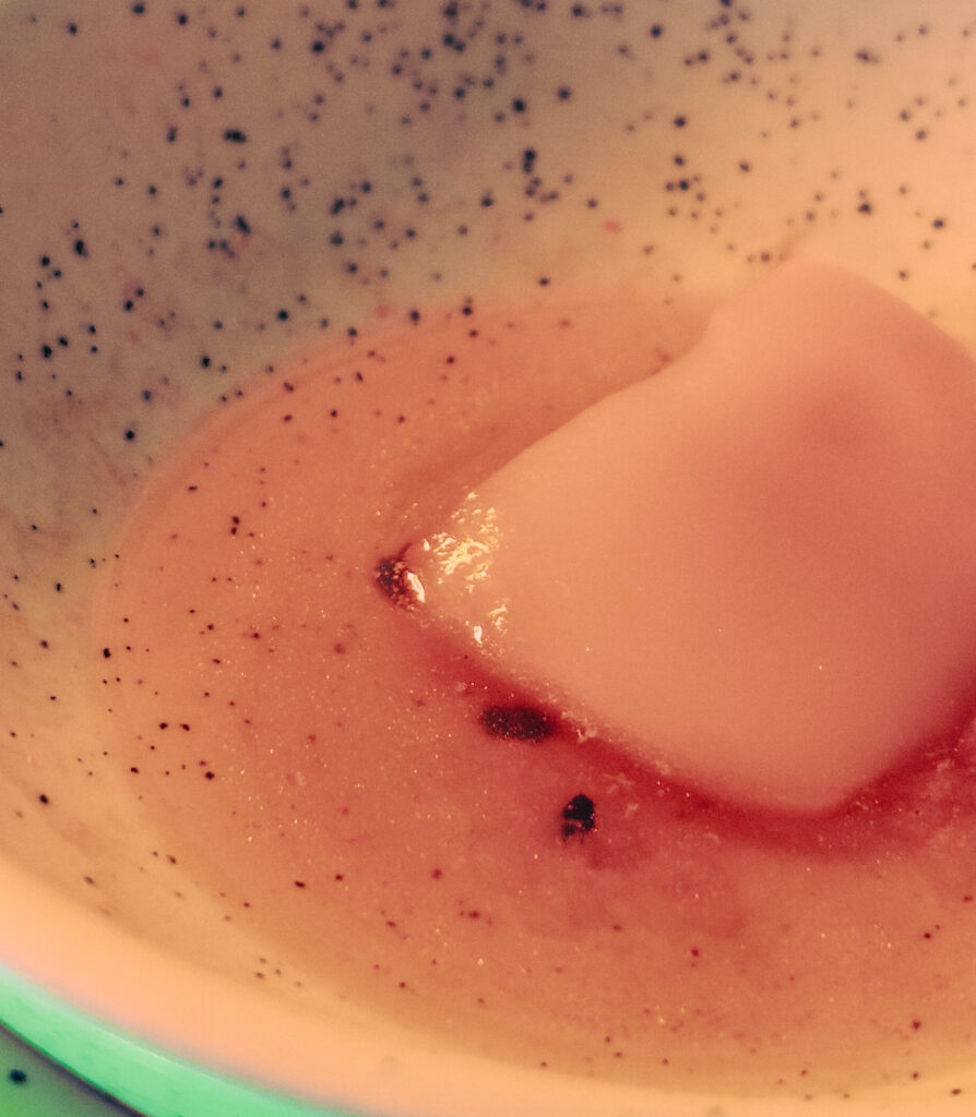 image of a wax melt melting down in a burner dish and releasing fragrance into the room