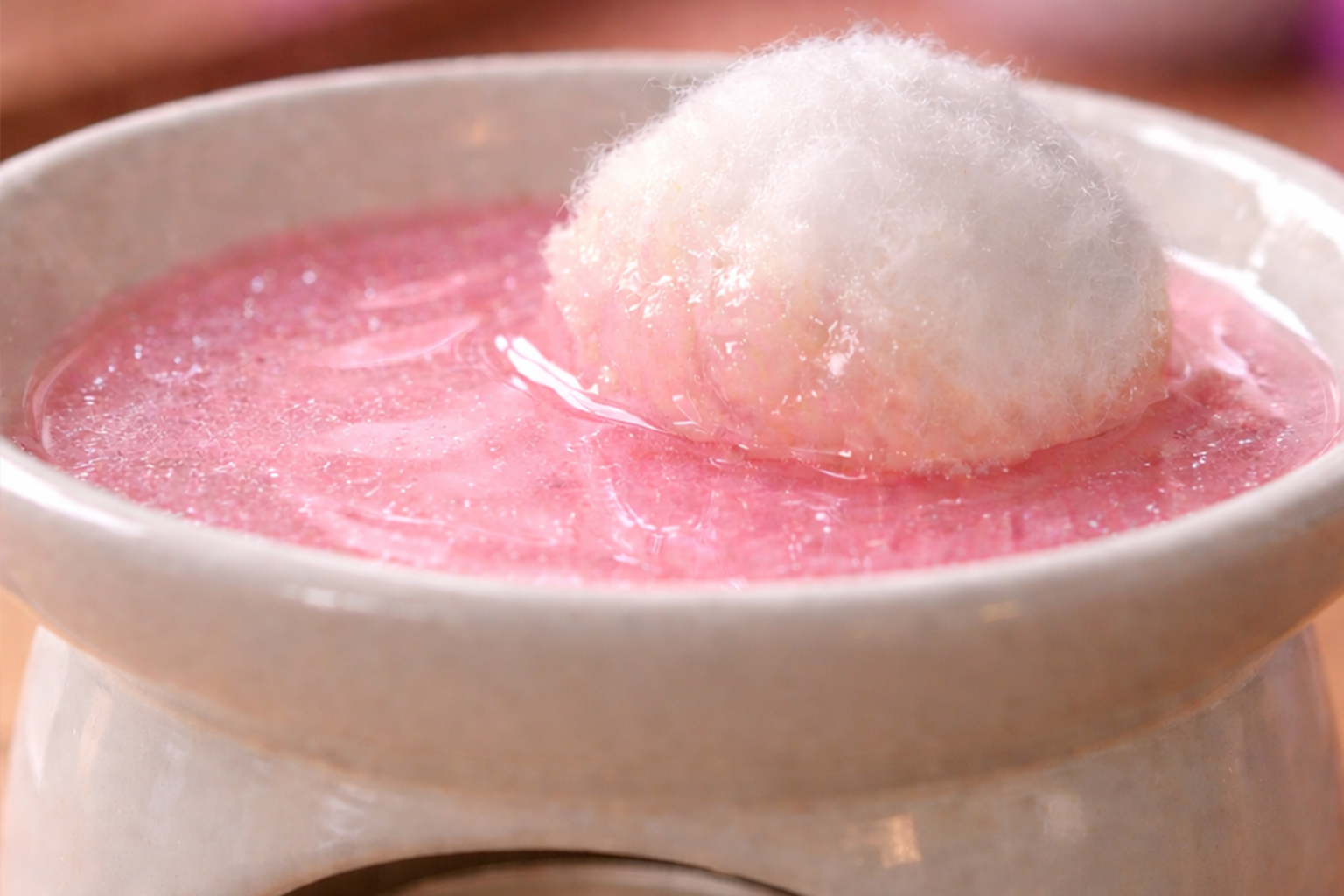 cotton ball soaking up wax melt pool