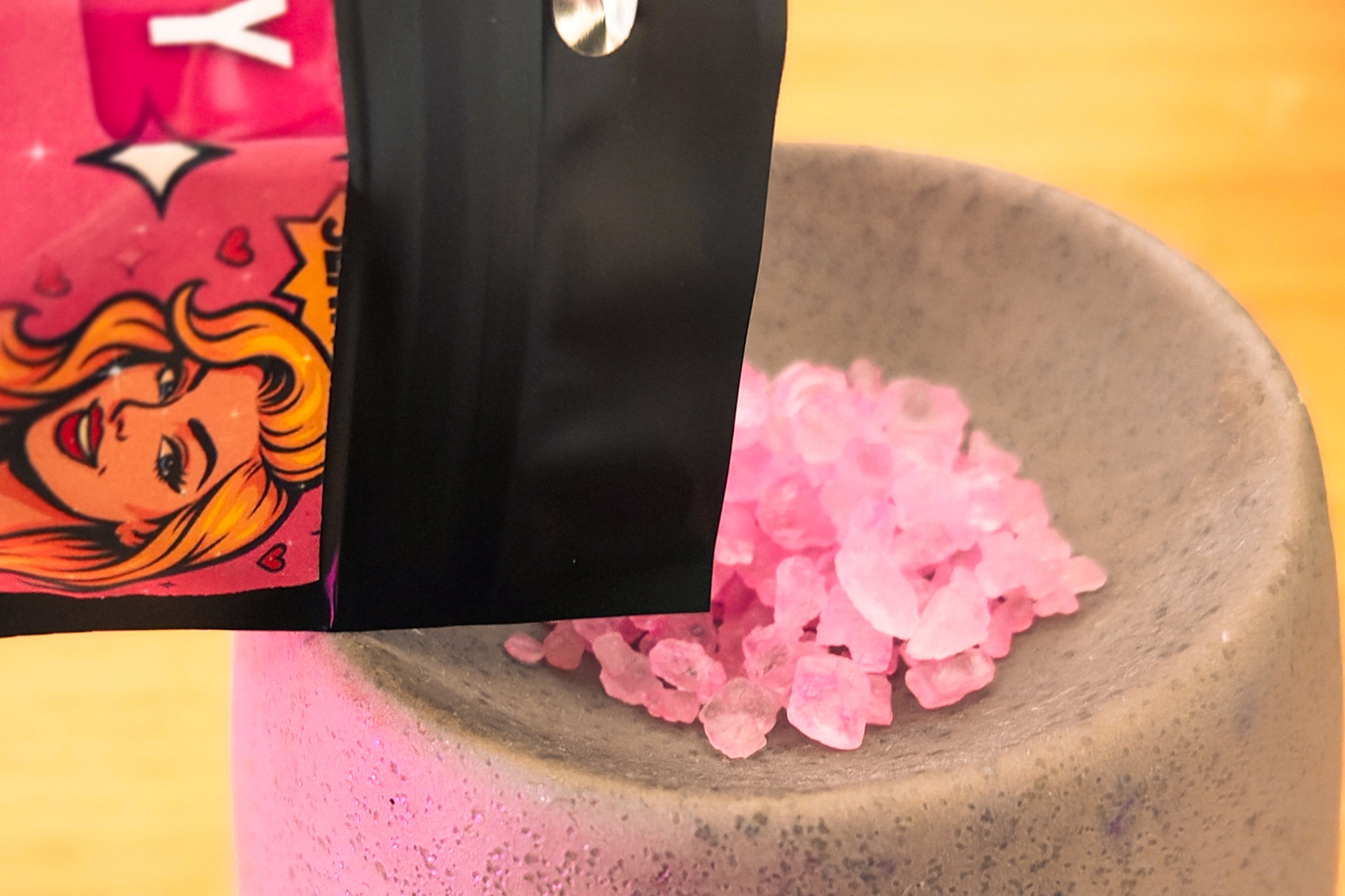 pouring sizzlers into wax melt burner to heat and release the fragrance